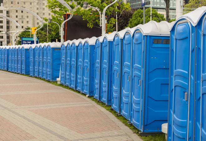 a row of portable restrooms at an outdoor special event, ready for use in Buffalo Grove, IL